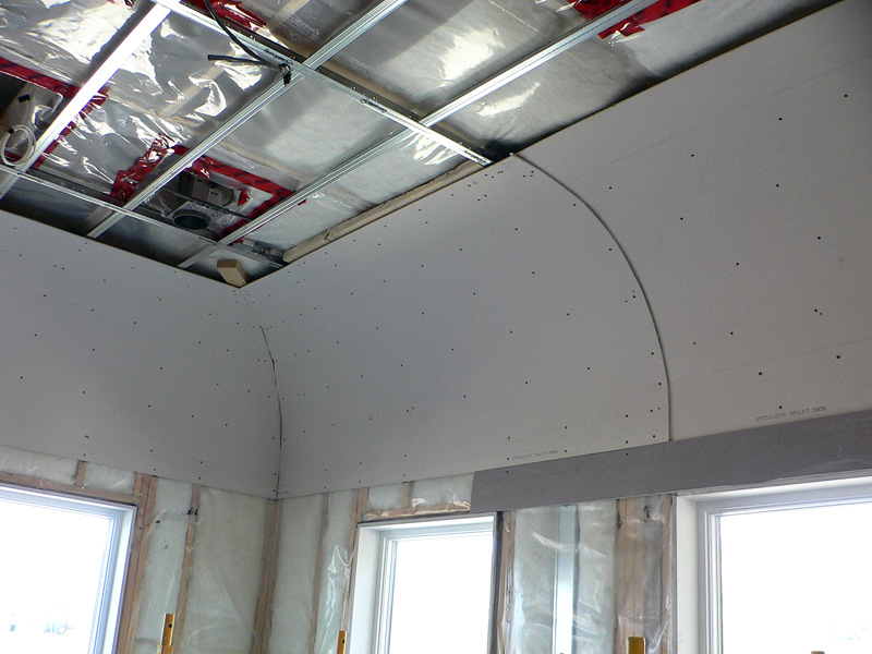 An example of Kelco Drywall's specialty frmaing installation, with metal frames and wooden sheets.