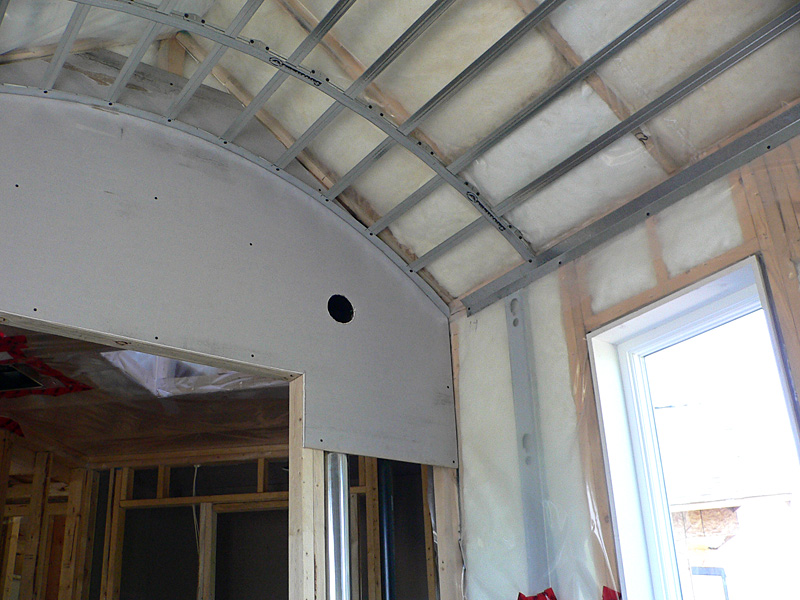 An example of Kelco Drywall's specialty framing installation in a room with a curved ceiling.