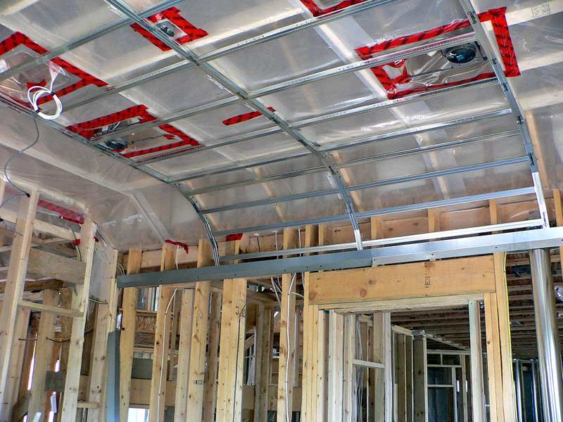 An example of one of Kelco Drywall's specialty framing jobs, n a room with a curved ceiling, using metal and wooden frames to create the curved shape in the ceiling.